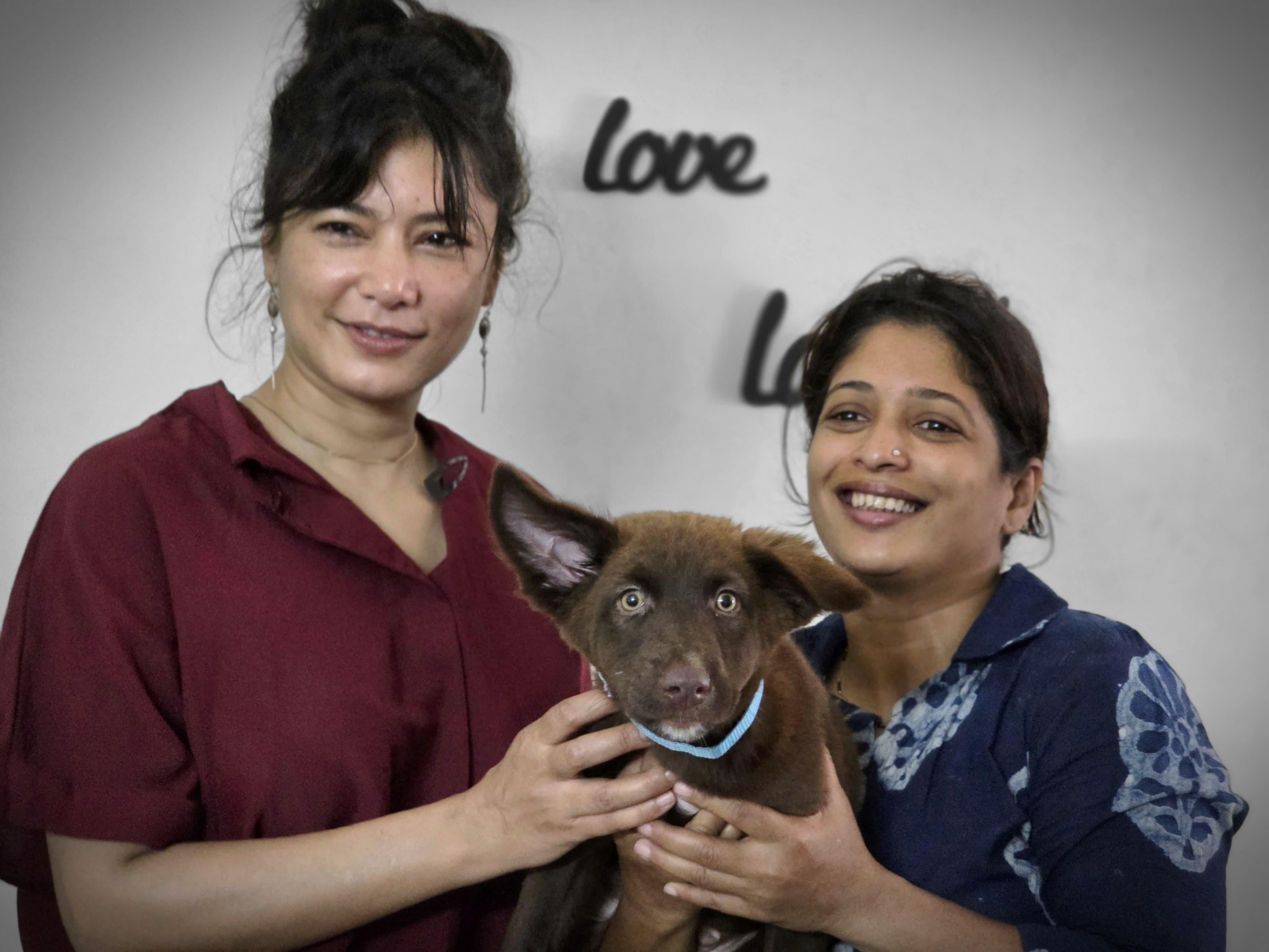 Adopted puppy Rusk with his family